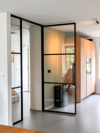 Modern custom-made steel partition and door in an elegant interior, perfect for a stylish and functional home layout.