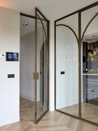 Hinged door with arched rod