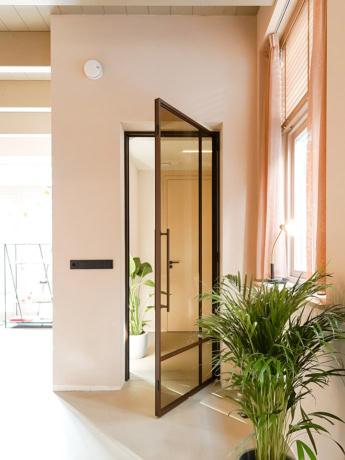 New design steel interior door with glass, modern and sleek finish for interior space, perfectly tailored by Aluwdoors.