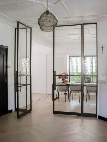 High-quality steel partition door with glass panels for modern interiors.