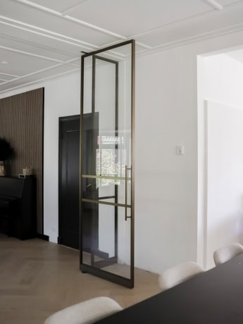 Aluwdoors Bespoke steel door with minimalist design and luxurious black metal frame.
