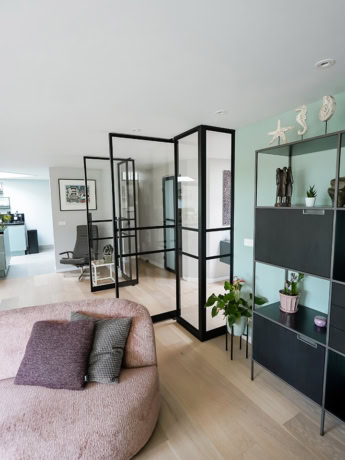 Luxury steel partition with custom-made doors in modern interior.