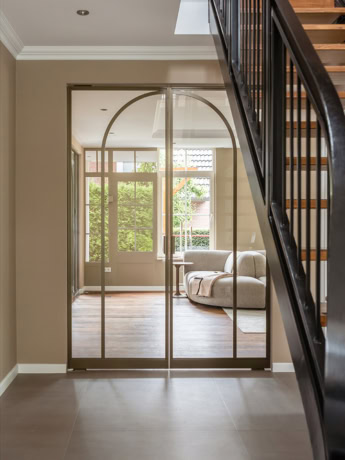 Elegant steel sliding door with glass panels and urbane look, perfect for a modern living space.