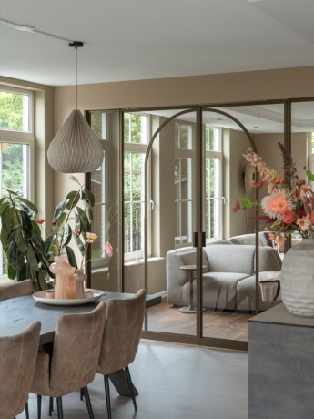 High-quality steel partition with sliding glass doors in a modern home decor, custom-made by Aluwdoors.