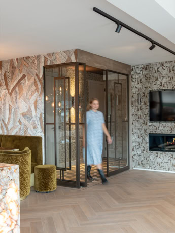 Aluwdoors steel partition with glass door in modern interior, customised and high-quality finish.