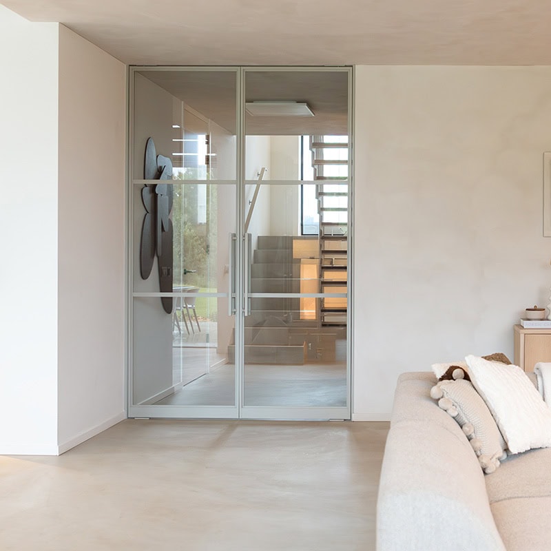 Rolling steel door with glass panels and modern finish.