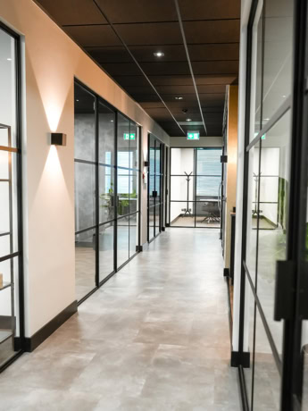 Rust-free steel interior doors with black frames, designed to suit modern office interiors.