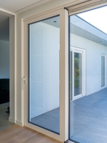 High-quality steel sliding door with white frame and large glass, perfect for modern interior and exterior finishes.