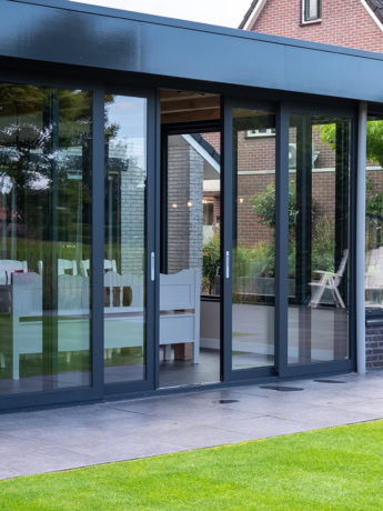 Modern steel sliding doors with large glass panes for a sleek look and maximum light.
