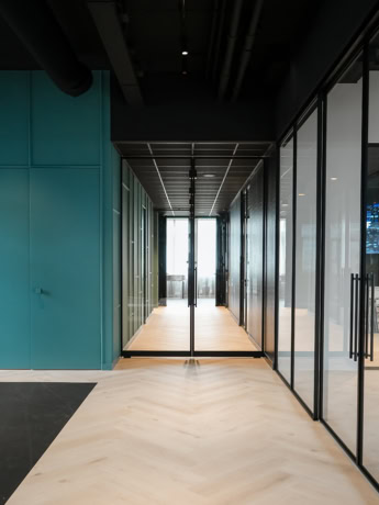 Bespoke steel glass partitions and doors for modern and elegant office design.