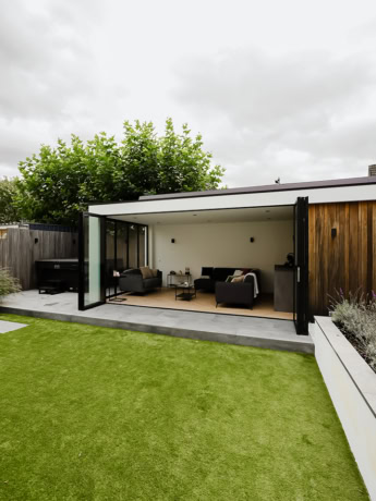 Luxury steel sliding door from Aluwdoors that brings a modern outdoor space inside.