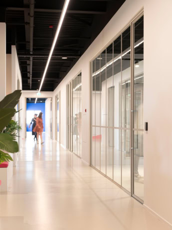 Glass steel partitions and doors in a modern office interior, custom-made for a sleek and stylish look.