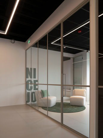 Modern steel roller door finished in matt black frame, ideal for creative and functional office spaces.