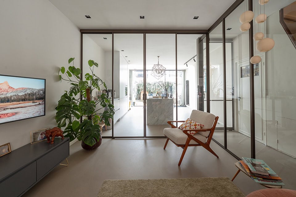 High-quality steel wall door with black frame and large glass panels, suitable for modern interiors.