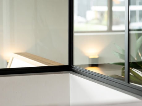 Elegant steel door with sleek black frame, perfect for modern interiors and room dividers, custom-made by Aluwdoors.