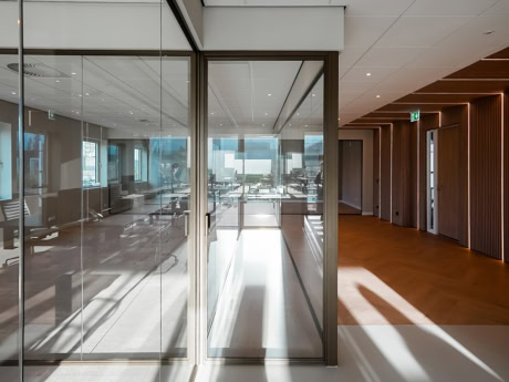 High-quality steel door with glass panels, perfect for modern office interiors, offering a sleek and industrial look, custom-made by Aluwdoors.
